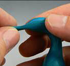 Blue clay being shaped